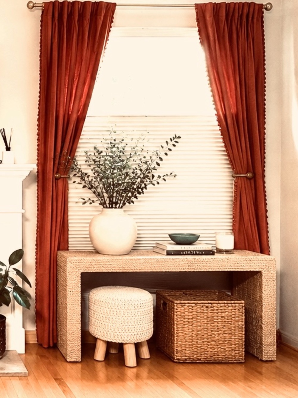 Burnt orange curtain panels with pompoms